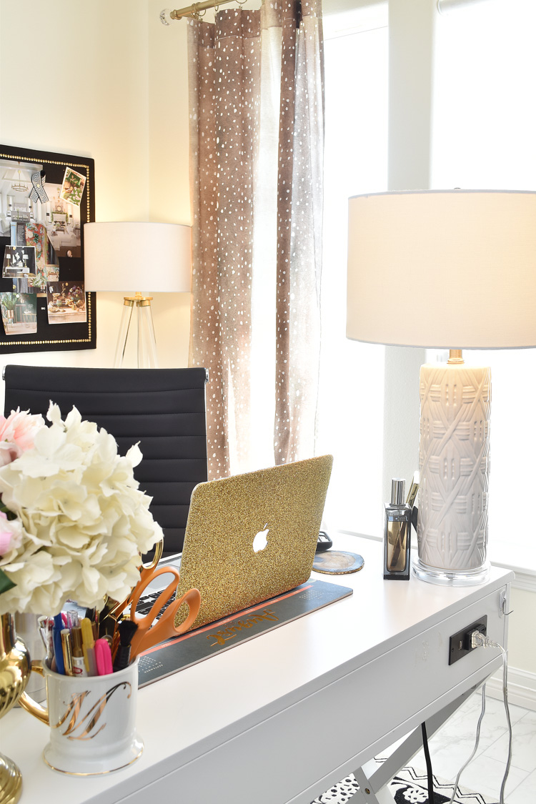 A sleek and feminine white and gold home office with fawn and antelope curtains and black, white and gold decor. A sleek and feminine white and gold home office with fawn and antelope curtains and black, white and gold decor.