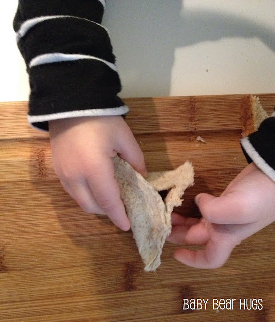 little hands making a hamentashen cookie