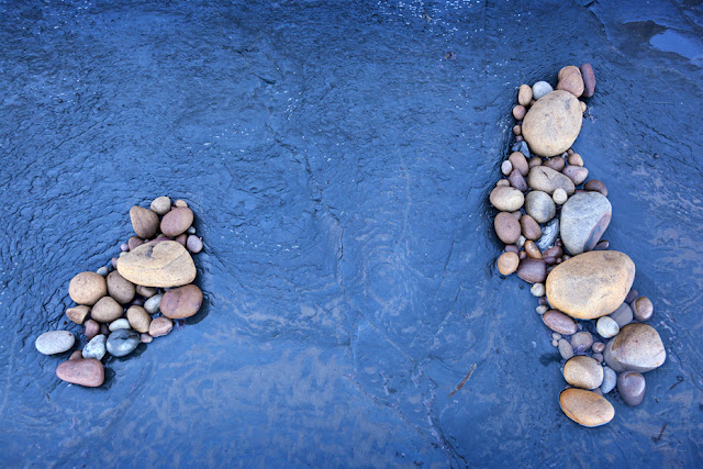 Pebbles collected on a rock shelf at Saltwick Bay by Martyn Ferry Photography
