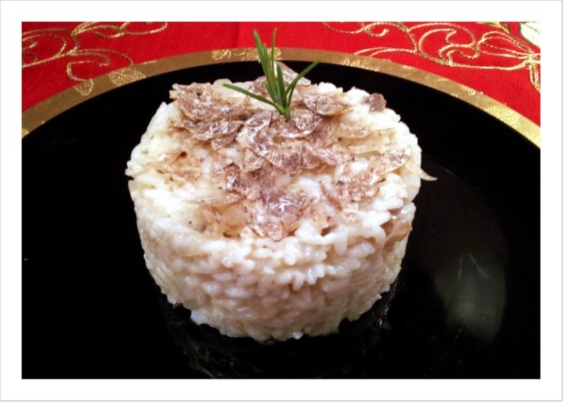 risotto allo spumante con toma e tartufo bianco.