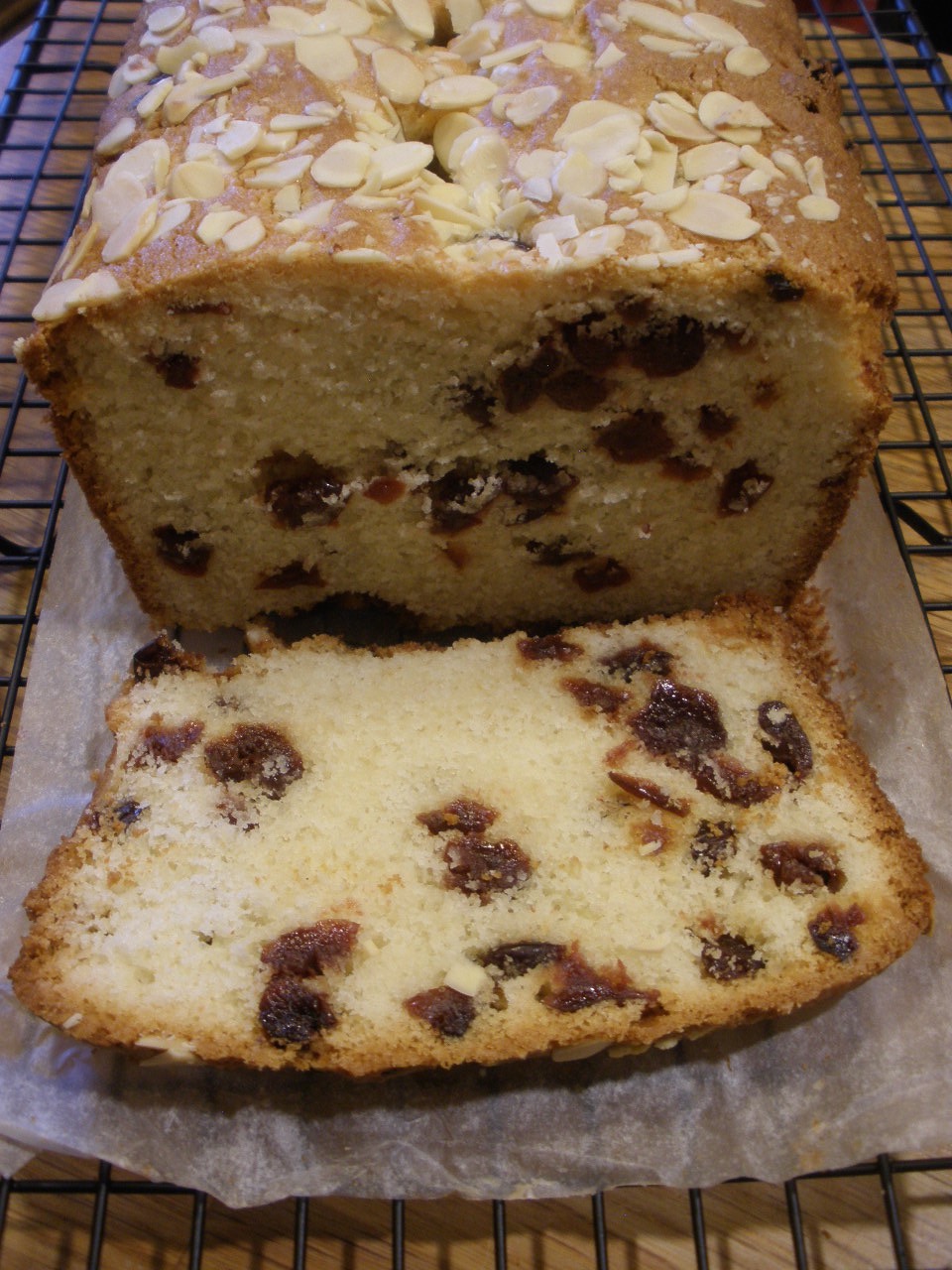 the half cut cook Cherry Almond Loaf Cake