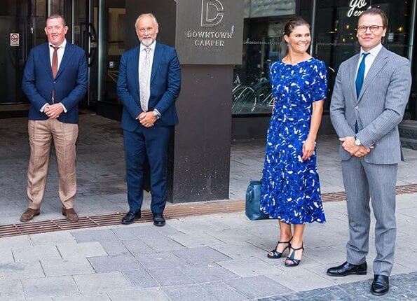 Crown Princess Victoria wore a floral dress by Rodebjer, and navy sandals by Saint Laurent, and blue diamond duchess earrings by Ebba Brahe