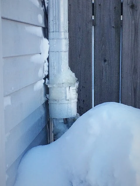 frozen downspout rain barrel connection