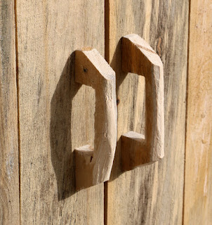 Two hand made handles for the double doors Two hand made handles for the double doors