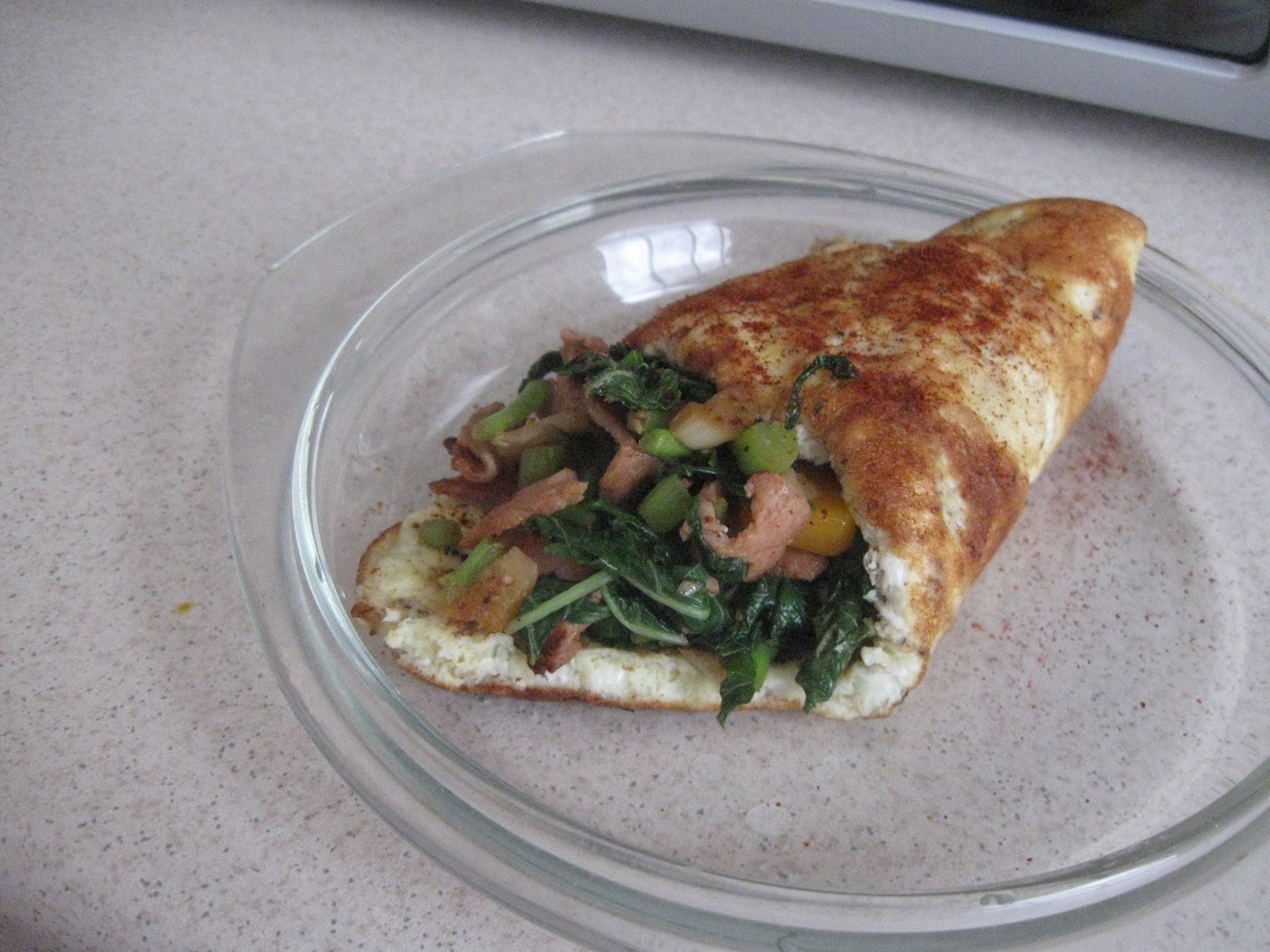 The Girl Next Kitchen... Egg rollup with spinach & bacon