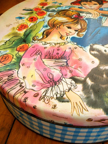 vintage gingham design kitsch enamel biscuit tin with girl, boy and dog
