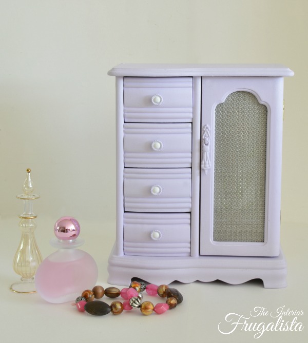A soft lavender vintage jewelry box armoire thrift store upcycle with chalk style paint plus how to replace the door glass with unique wire cloth.