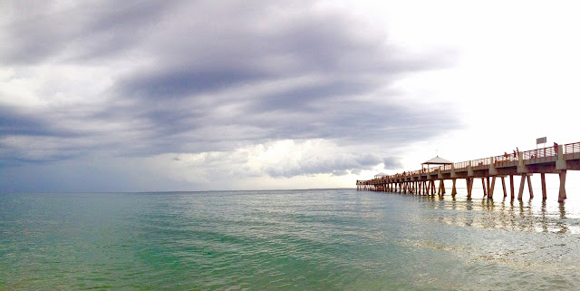 clouds over the ocean at Juno Pier