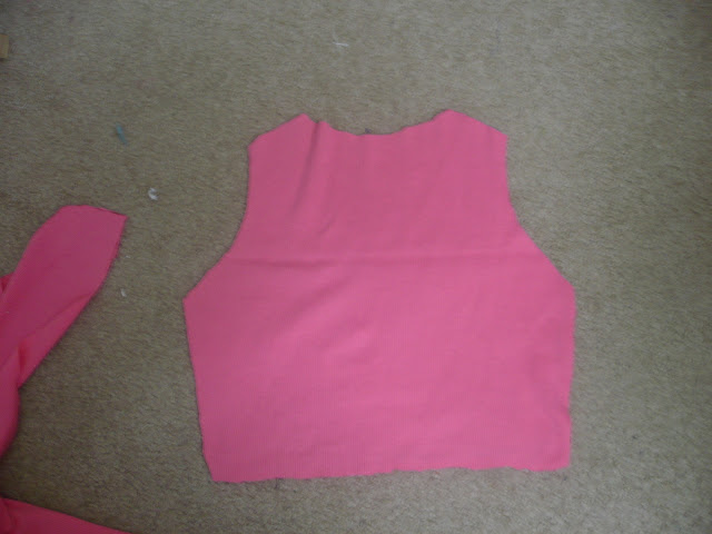 Cut the back of the shrug using another shrug for sizing.