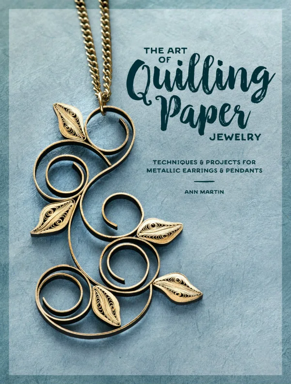 Cover of The Art of Quilling Paper Jewelry features a golden scrolled paper pendant on a gold necklace chain