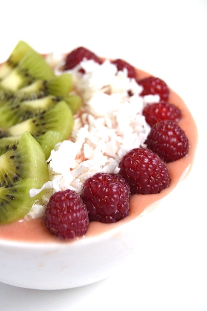 This Tropical Smoothie Bowl makes the perfect breakfast or snack with pineapple, mango and strawberries and tropical toppings! www.nutritionistreviews.com