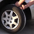 A YOUNG MAN WRAPS A ROPE AROUND THE FRONT WHEEL AND PULLS WITH ALL HIS MIGHT. THIS TRICK CAN SAVE YOU WHEN YOU NEED IT THE MOST.