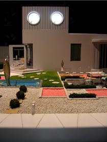 Model of a modernist villa from the film 'Mon Oncle' with a garden containing a pond with a fish fountain in the middle.