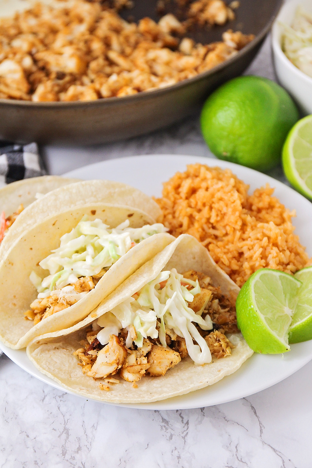 These flavorful skillet fish tacos are a delicious and easy to make thirty minute meal! 