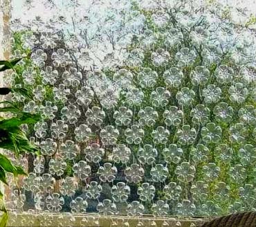 Making curtains of plastic bottles in living room