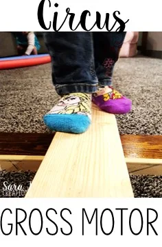 Make a simple balance beam with 2x4s to practice balance and gross motor skills during a circus unit.  Perfect for a rainy day!