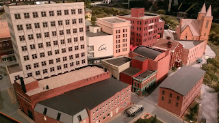 miniature buildings as part of model railroad exhibit