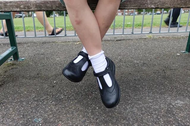 A pair of bruised legs, white socks and Term Footwear school shoes