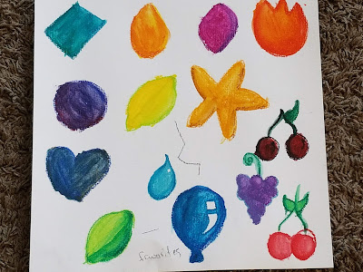 different shapes painted with water color by kids