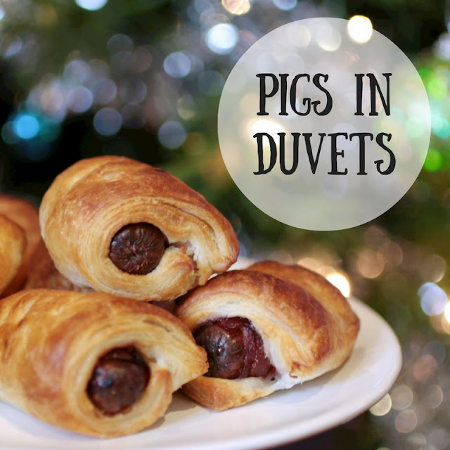 A twist on the classic Christmas pigs in blankets - chipolatas wrapped in streaky bacon snuggled with cranberry sauce in flaky pastry