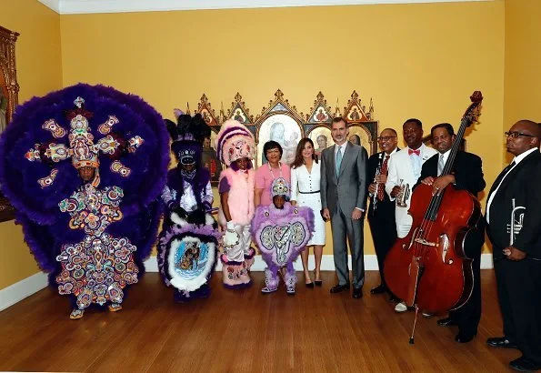 Queen Letizia wore Felipe Varela white dress and Magrit pumps at the Mardi Gras Indians show at New Orleans Museum of Art in City Park