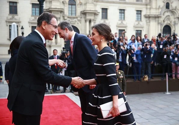 Queen Letizia wore Carolina Herrera striped fit and flare dress. Queen wore a new dress by Carolina Herrera. President Vizcarra and his wife
