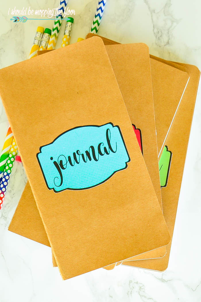 DIY Travel Journals | Fun little journals perfect for vacation memories. Download the free printable labels in the post to make these.