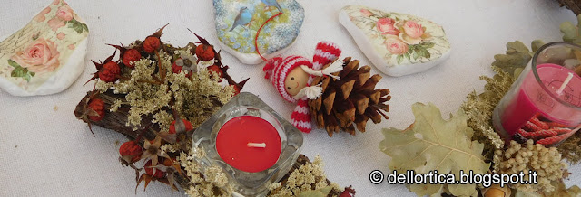 Natale addobbi sassi decorati ghirlande luna solstizio candele nel giardino della fattoria didattica dell ortica in Appennino vicino Zocca