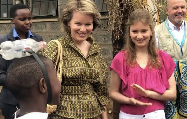 Queen Mathilde Dries Van Noten jacket and trousers, Natan dress, Crown Princess Elizabeth in Maje blouse and white trousers