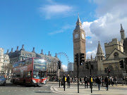 . a Red Double Decker bus and the London Eye in the background.