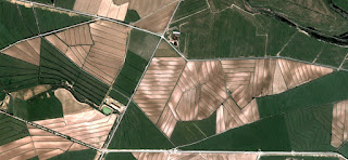 Abstract Naturalism, Spain fields from the air, abstract expressionist photography, Spain fields from the air, abstract landscape, fantasy imaginary forms, abstract surrealism, artistic representation of human labor camps