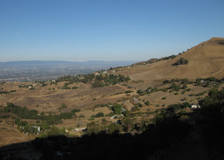 Moon setting above the smoggy valley, viewed from the lower slopes of Mt. Hamilton, California