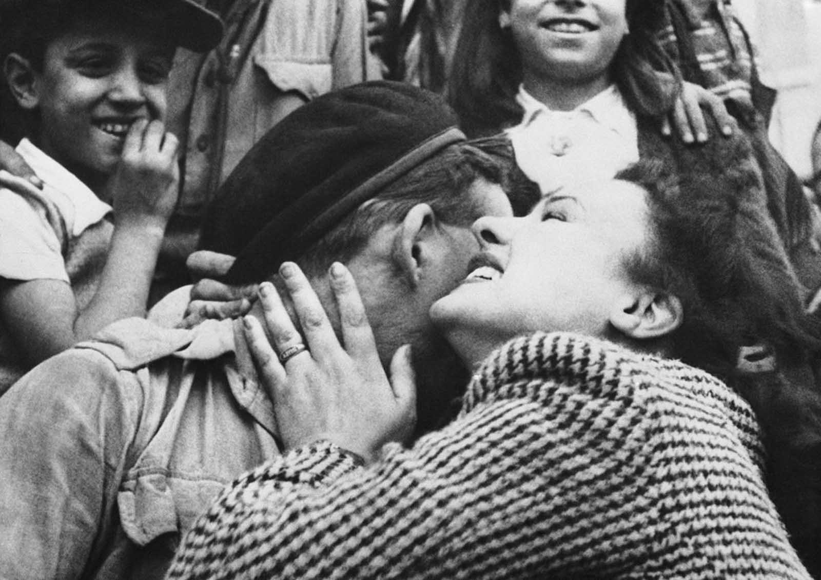 Wildly enthusiastic citizens of Tunis greet the victorious allied troops who occupied the city. A British tankman gets a personal welcome from a Tunis resident in Tunisia, on May 19, 1943.