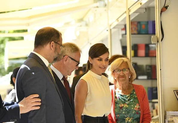 Queen Letizia wore Hugo Boss Exina sleeveless top, and the queen wore Hugo boss denim skirt jeans