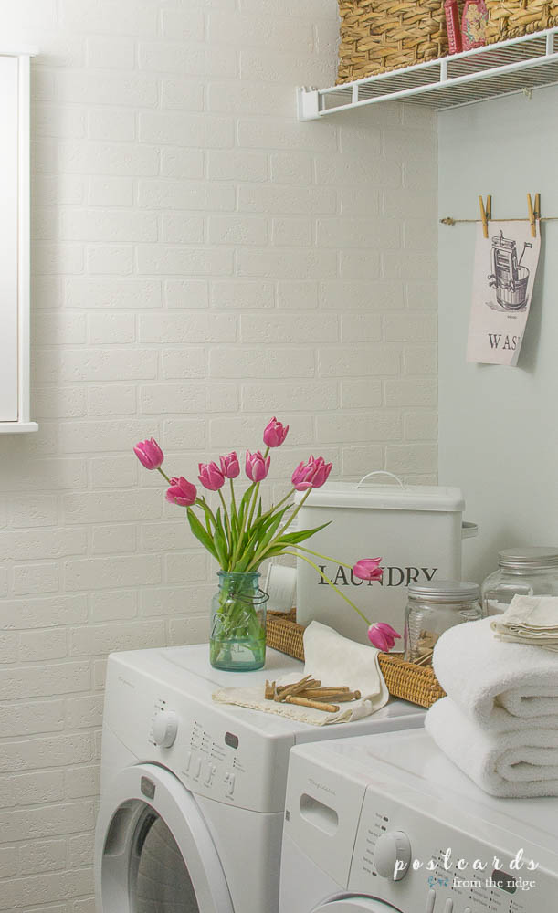 laundry room makeover with brick wallpaper