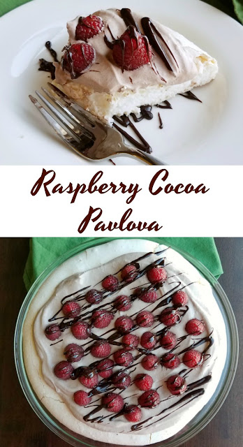 Turn a cloud into dessert. This dessert is both simple and amazing. A light and crisp meringue topped with cocoa whipped cream, fresh raspberries and a chocolate drizzle. Raspberry cocoa pavlova may be your new favorite dessert! If ever there was a perfect dessert, this might be it. A crisp meringue base that gives way to a marshmallow-y center. Fluffy chocolate whipped cream nestled on top. A smattering of delicious fresh raspberries and a drizzle of chocolate to finish it off. This is a symphony of textures and a delightful mix of flavors. Make one today to find out for yourself!
