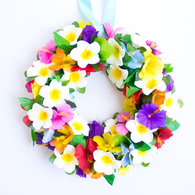 Make this tropical flower wreath for your front door this summer! It would also be perfect for a luau or pool party! Make this tropical flower wreath for your front door this summer! It would also be perfect for a luau or pool party!