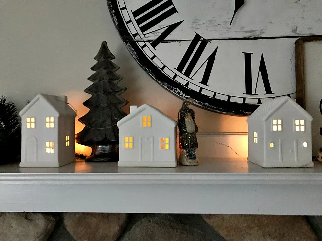 Mantel with houses with lights