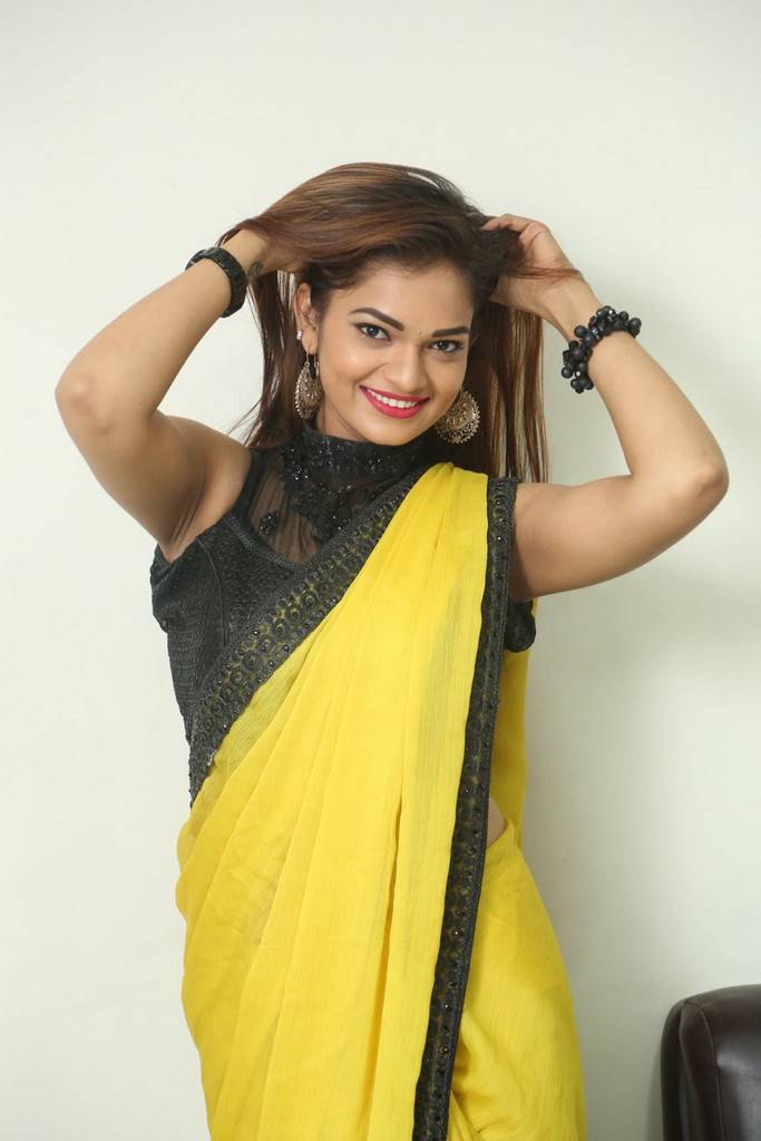 Telugu Girl Aswini Navel Hip Gallery In Transparent Yellow Saree