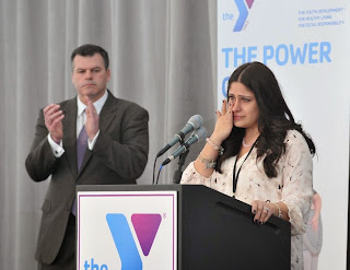Mimo Jaber of Wrentham, MA shows emotion as she speaks of the support that the Y's scholarship program has helped her family's life
