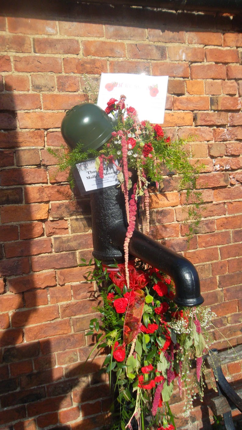 LEST WE FORGET: A floral tribute remembering the WW1 contribution made by member of the Forces from Brigg. This is the old water pump on Grammar School Road, South.