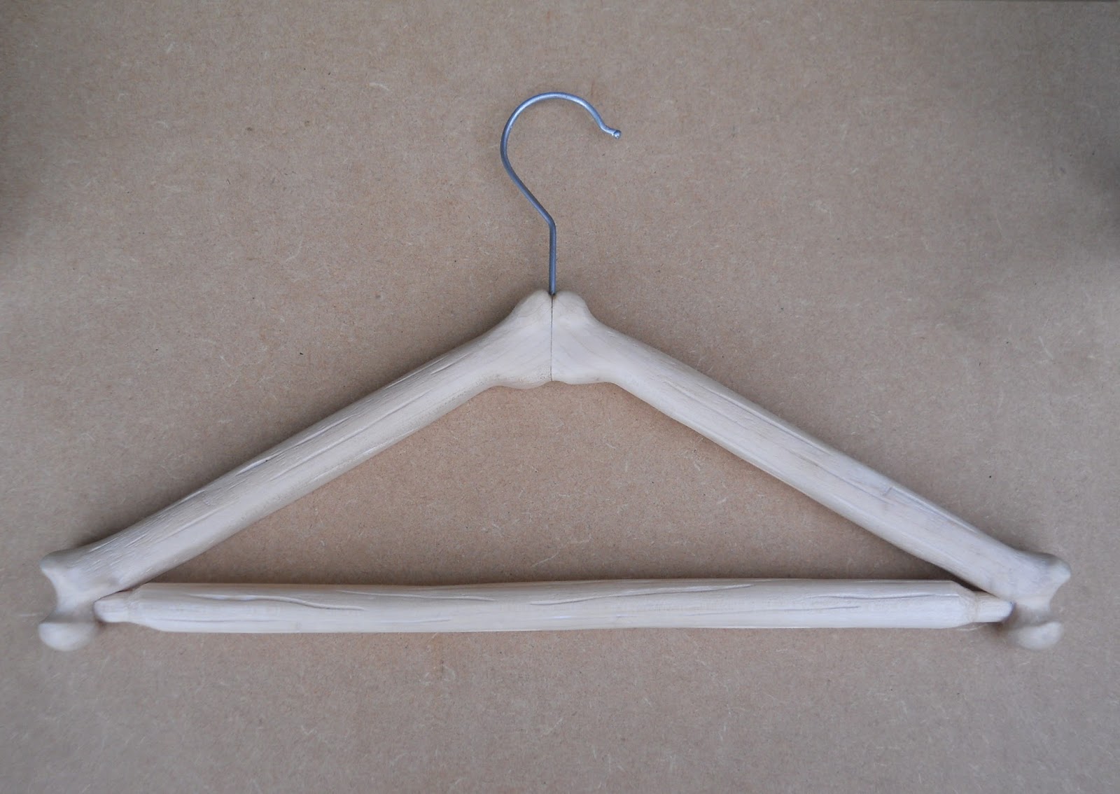 An unusual carved wooden coat hanger commission Carvings with Stories