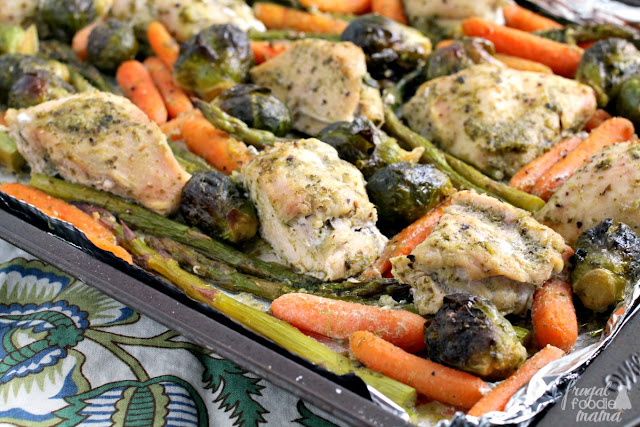 This flavorful & easy to make Pesto & White Wine Chicken & Veggies will quickly become your new go-to sheet pan dinner recipe.