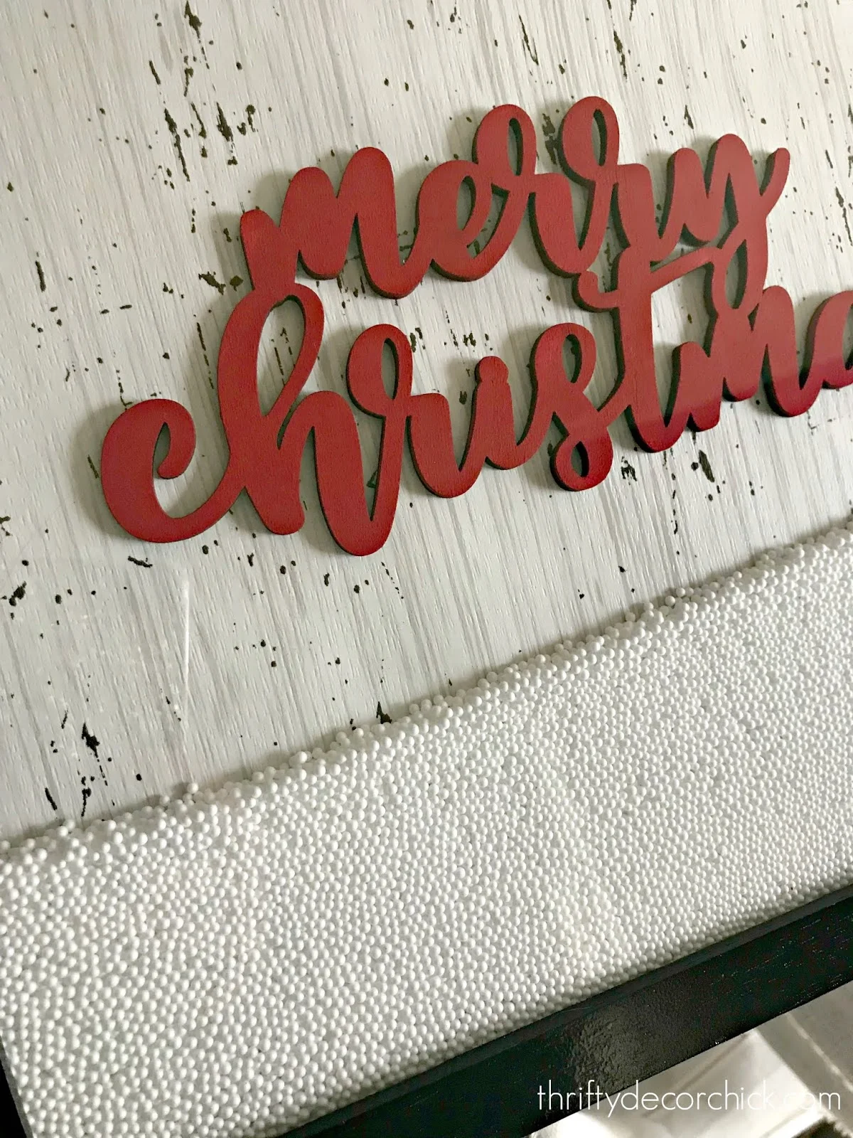 Fake snow in frame Christmas sign