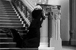 gif of a lady on a fancy staircase, pretending to faint in dramatic slow motion