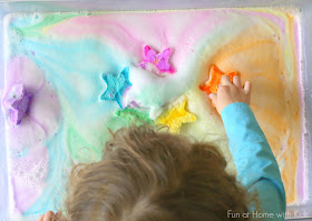 A NEW play recipe:  Magic Foaming Stars.  Add them to your shallow tray and watch as they shoot out rays of colored foam.  Search through the mound of puffy ice cold foam produced to find the treasures once hidden inside.  From Fun at Home with Kids