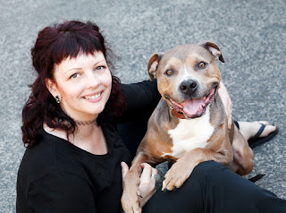 Ruth O'Leary pet photographer with one of her smiling rescue dogs
