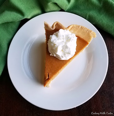 slice of maple pumpkin pie with whipped cream