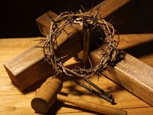 Wooden cross,hammer and crown of thorns with nails at the crucifixion of Jesus Christ