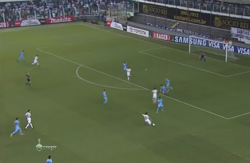 Santos player Elano shoots from long range to score the opening goal against Bolívar